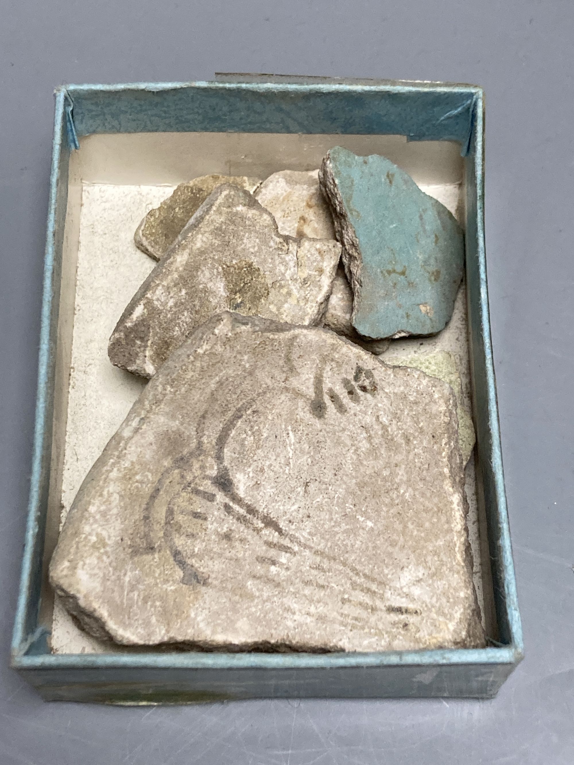A group of Egyptian pottery fragments, Coptic period, together with a Syrian Islamic pottery oil lamp fragment